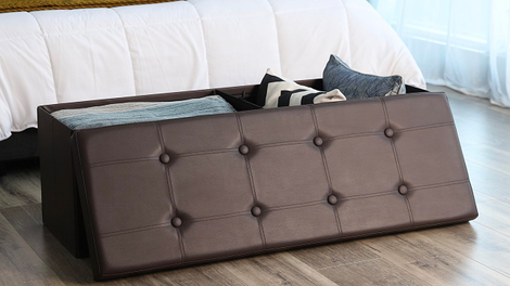 SONGMICS 43" Faux Leather Folding Storage Ottoman Bench | $42 | Amazon | Discount available in white and brown colors